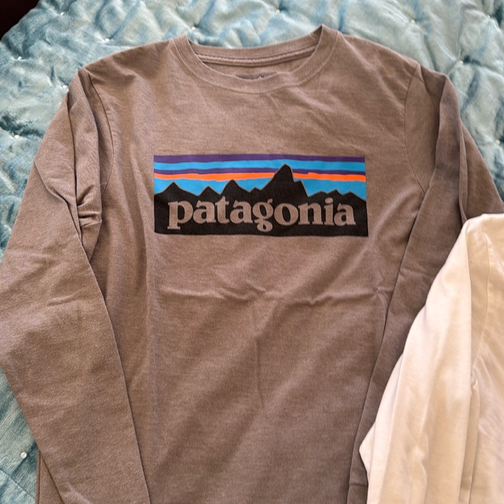 2 Patagonia long sleeve t shirts. Youth xl(14). Barely worn  one gray, one white